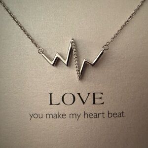 Sterling Silver “Love” Necklace with Small Diamonds. 18” (adjustable to 16”.)